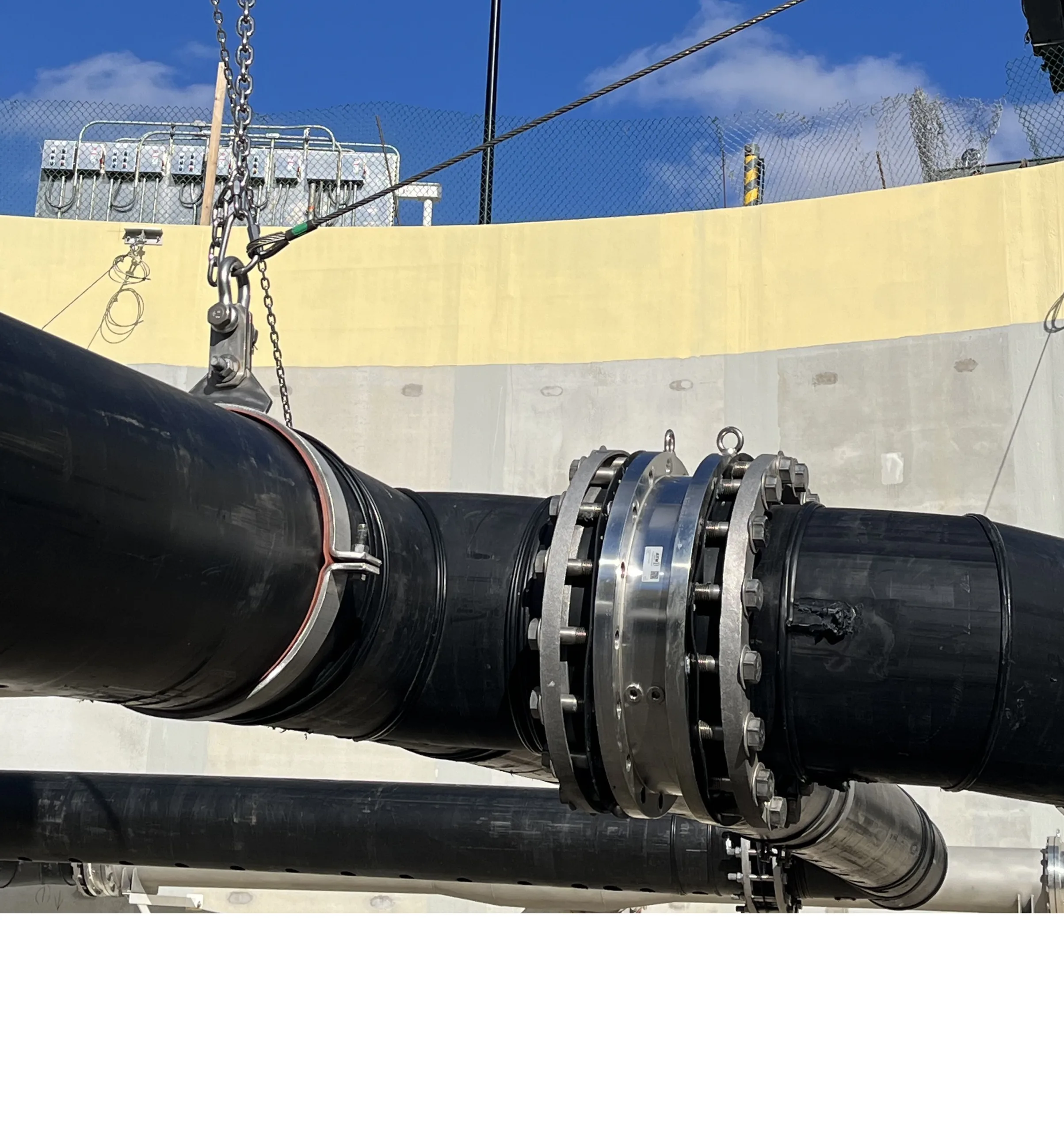 Black pipeline with swivel joint at a wastewater treatment plant