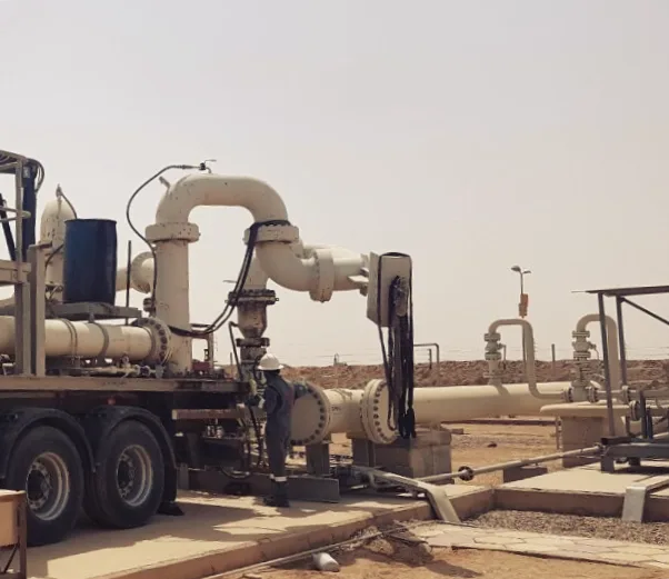 Pipework with swivel joints at an oil and gas site in the desert