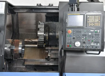 Control panel and work area of a CNC lathe