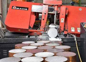 Amada band saw with steel bar stock