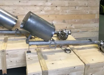 Stainless steel swivel pipe assembly on a transport crate