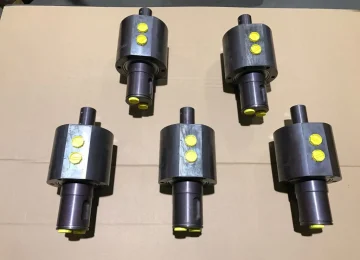 Five ATN rotary unions with yellow protective caps