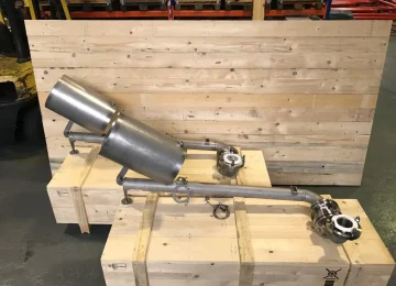 Stainless steel swivel pipe assembly on a transport crate